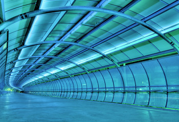 Fotobehang Tunnel Futuristische tunnel met blauwe gloed  © Creativa Images