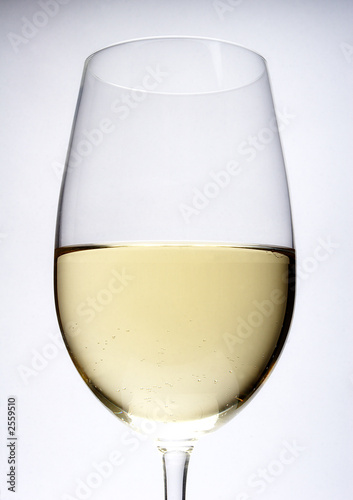 close up of white wine in glass