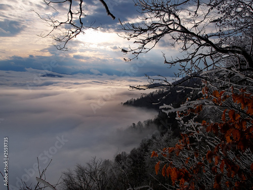 sunset over the fog in autumn season