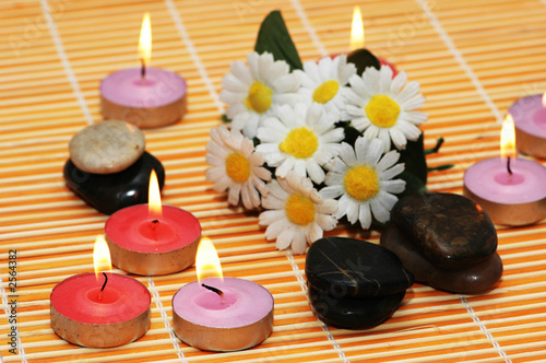 flowers  stones and candles  for spa treatment