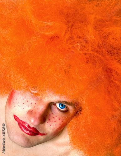 red haired angry man with a clown make-up