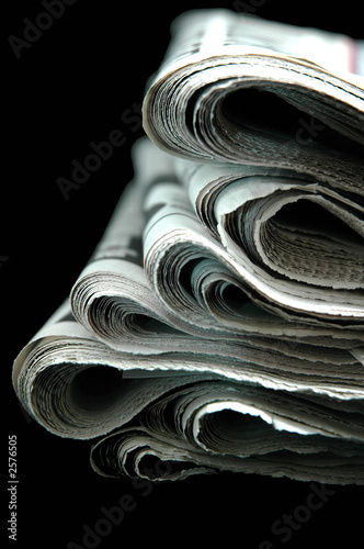old news papers side on