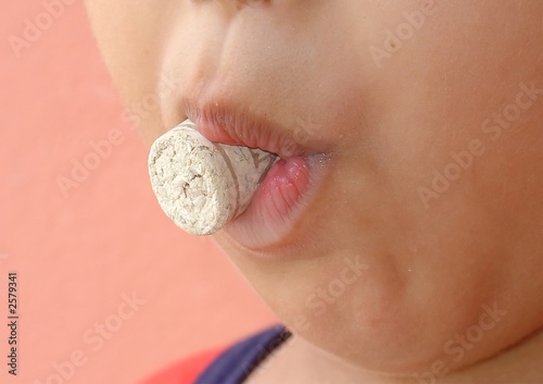 kid with a cork in the mouth