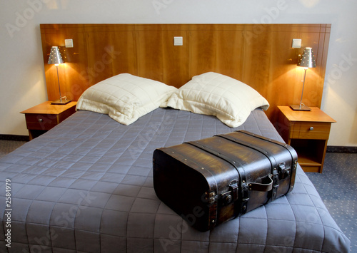 фотографія hotel room with suitcase