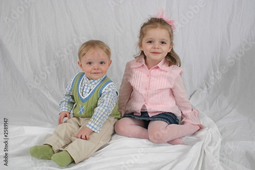 brother and sister sitting together.