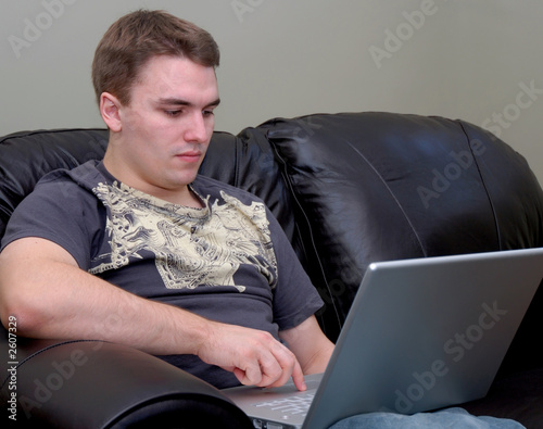 casual young man with laptop computer