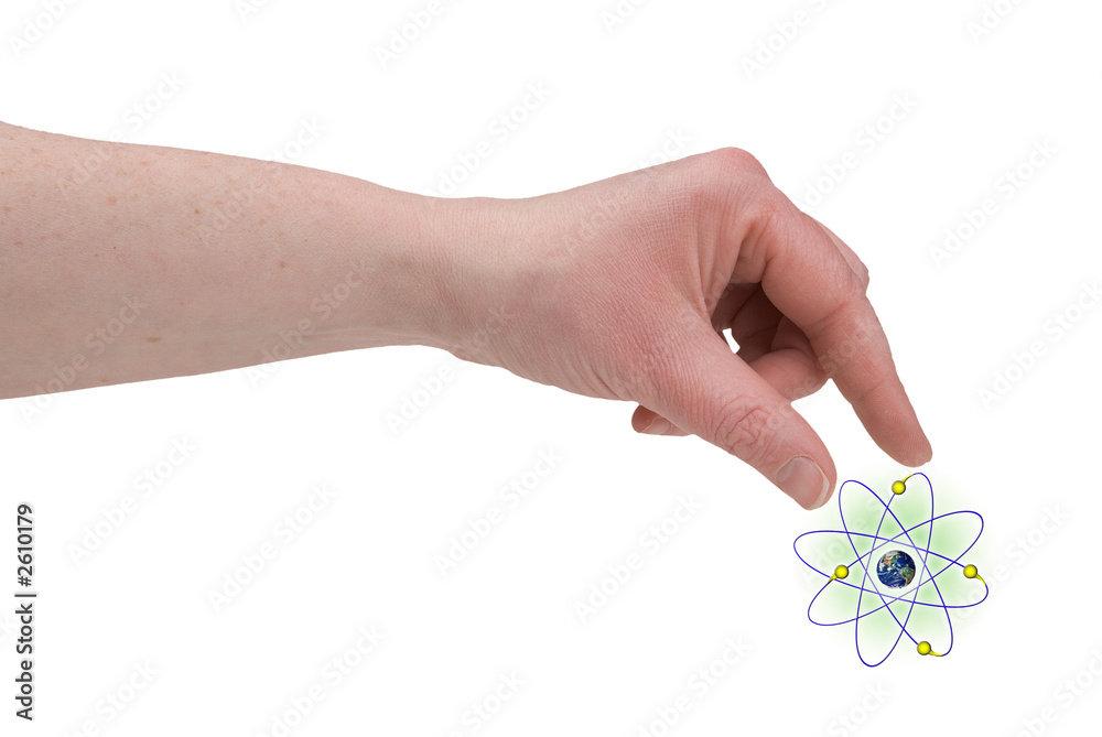 Fototapeta premium woman's fingers piching nucleus of an atom