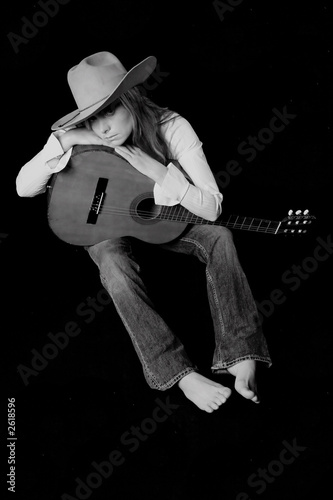 singer with a cowboy hat and guitar
