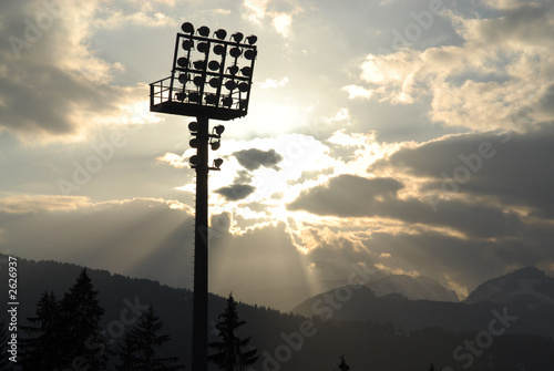 Flutlichtmast im Wolkenmeer / Sportarena -stadion photo