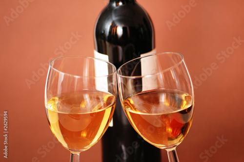 two wine glasses and bottle of wine