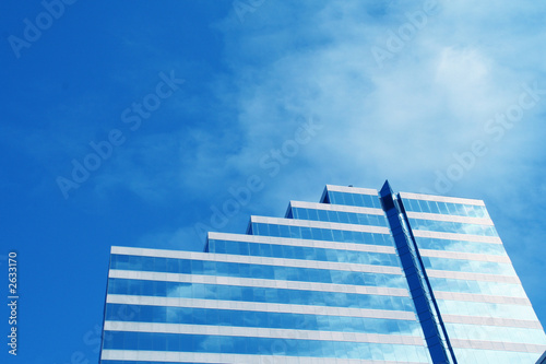 skyscraper in perspective with blue sky in background