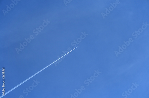 jet airplane going up in the blue sky