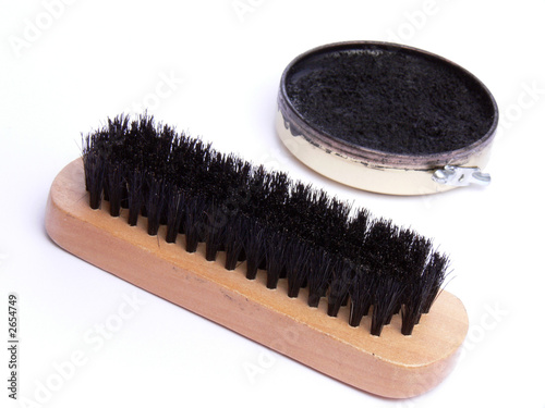 brush and black shoe polish