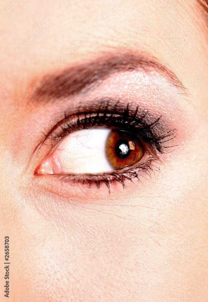 Fototapeta premium closeup of beautiful blonde female hazel colored eye looking to