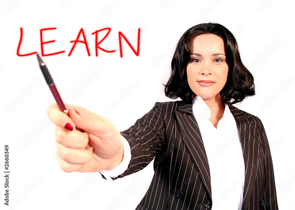 beautiful business woman holding pen in front of h beautiful business woman holding pen in front of h