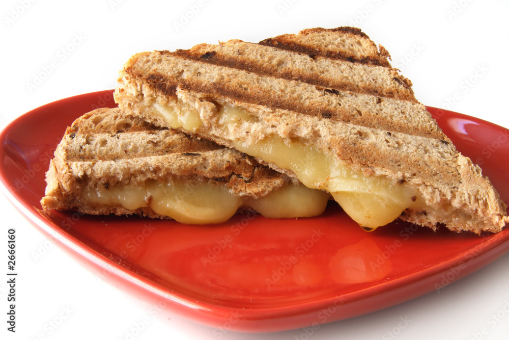 sandwich with melted cheese on heart shape plate sandwich with melted cheese on heart shape plate