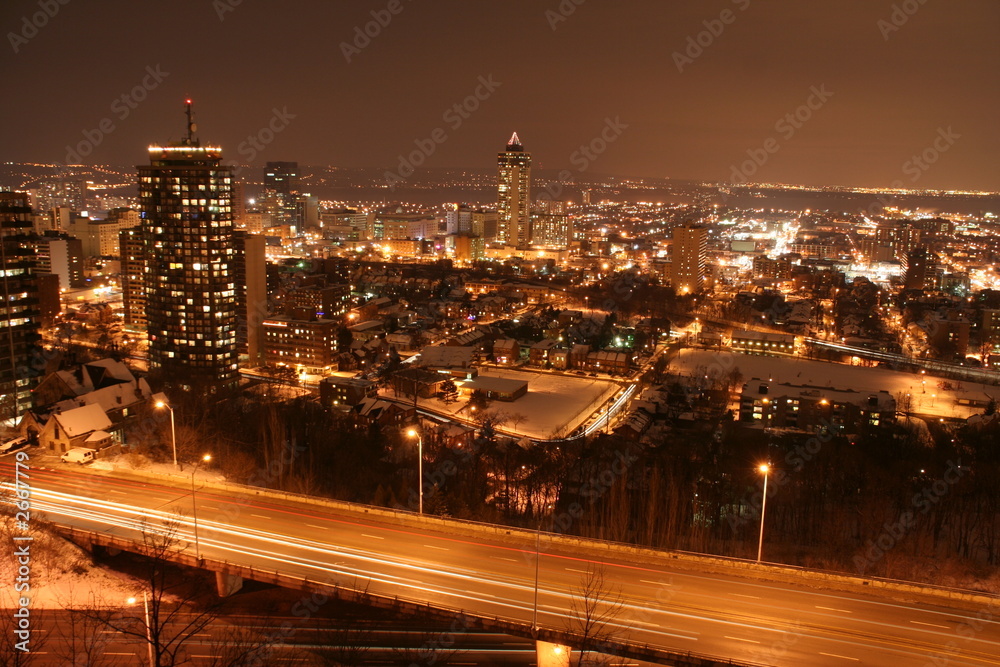 city lights at night time with a super high way of