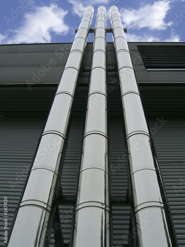 three pipes rising highly in the sky