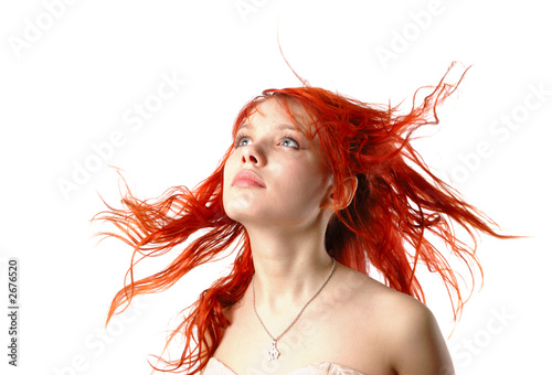 young girl in the wind looking forward - isolated
