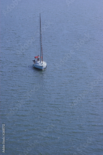 lone sailboat at sea