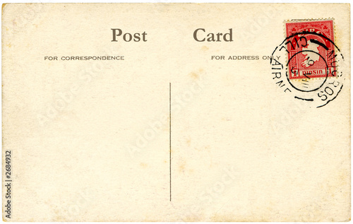 a vintage blank irish postcard with a red stamp.