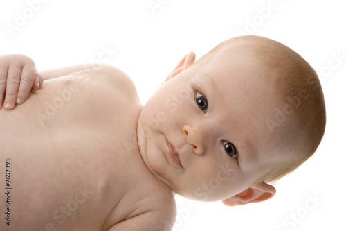 baby on side with happy look