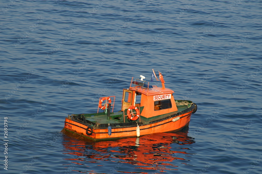 Obraz premium security boat on a port