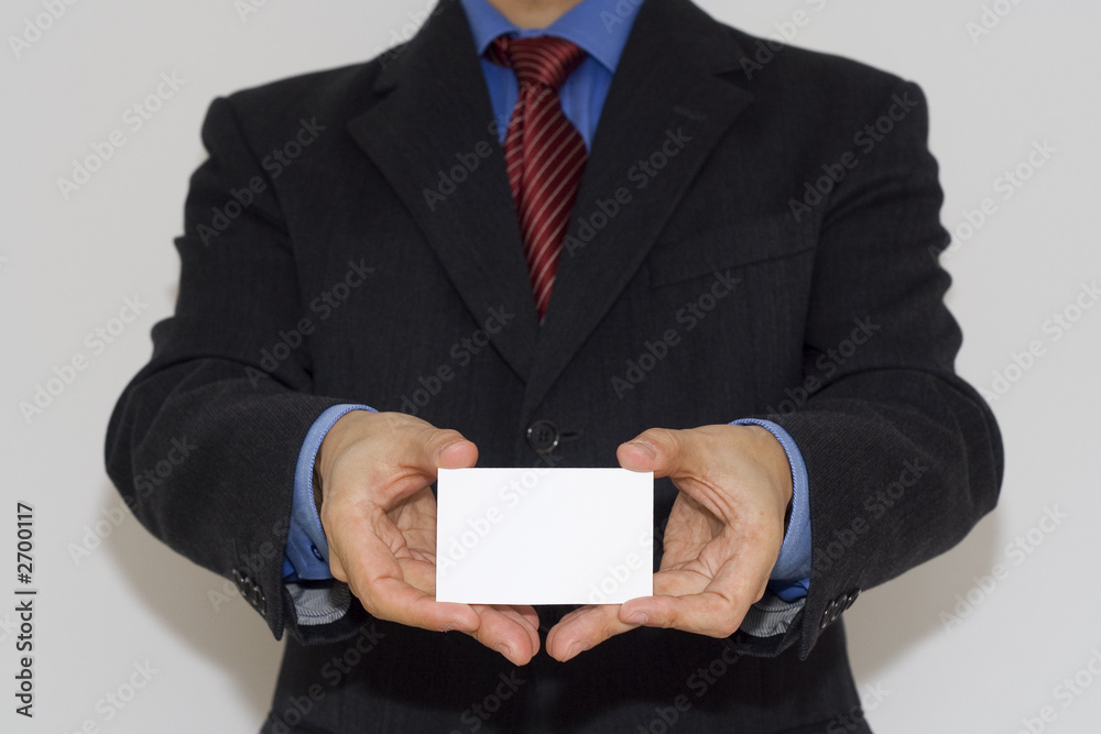 bussiness man holding a card with both hands bussiness man holding a card with both hands