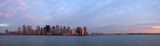 scrape sky building shore line at the sunset from a boat, new yo