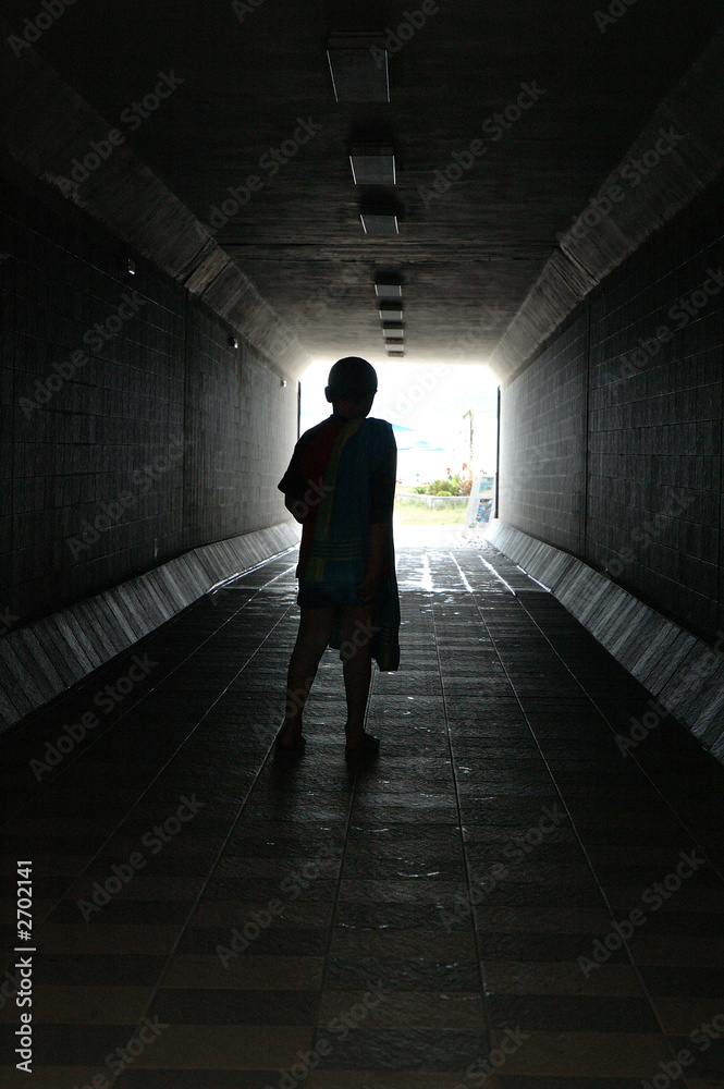 a child in dark tunnel a child in dark tunnel