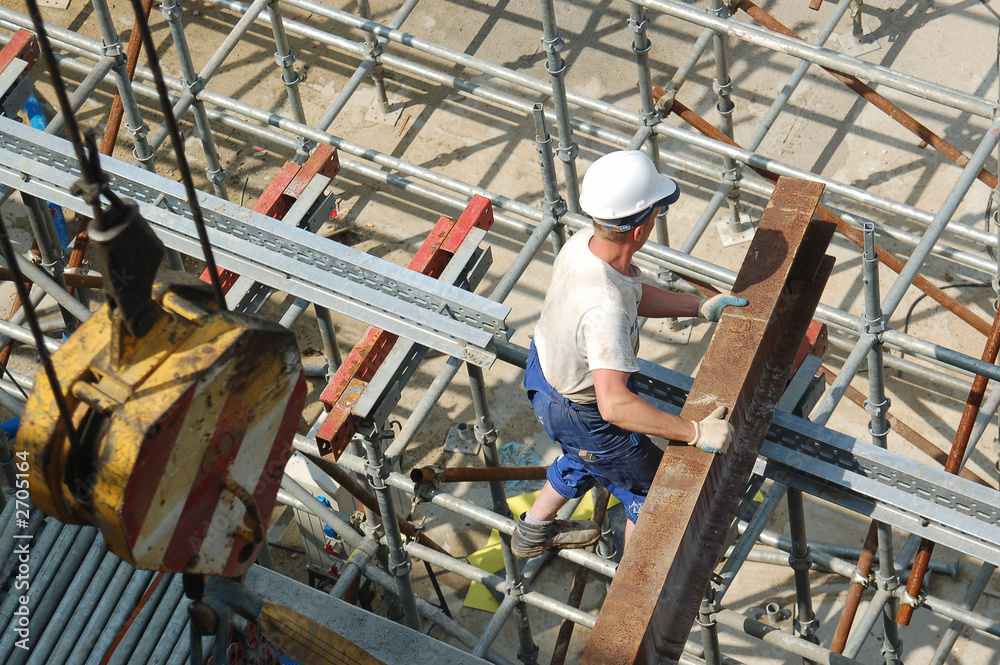 construction worker with steel beam construction worker with steel beam
