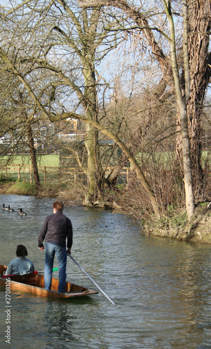 man punting along river thames