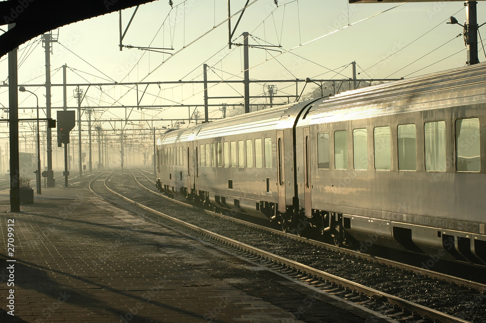 silver train in early morning fog
