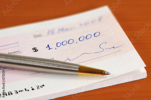 one million dollars cheque and a pen