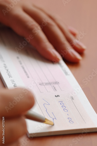 signing a money cheque