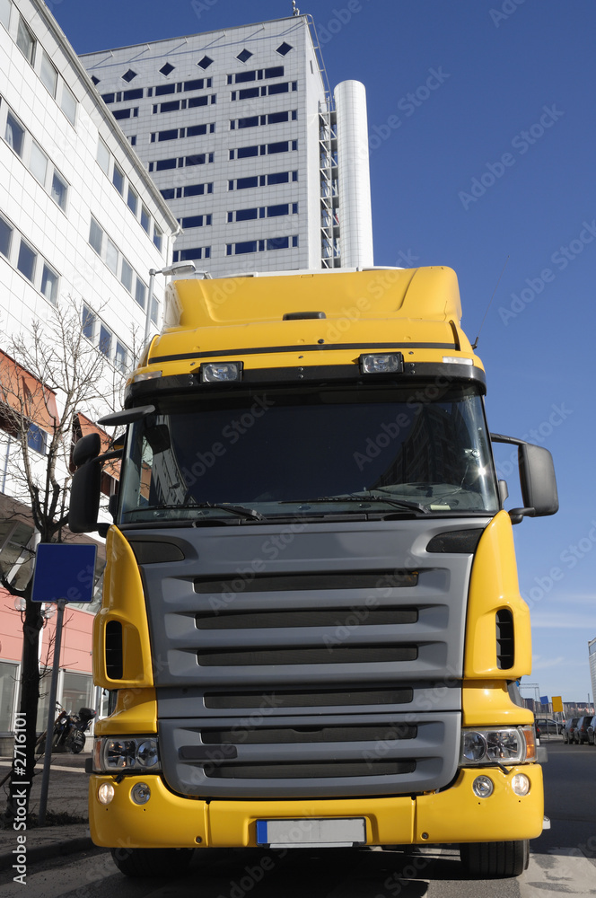 yellow truck-front in commercial area
