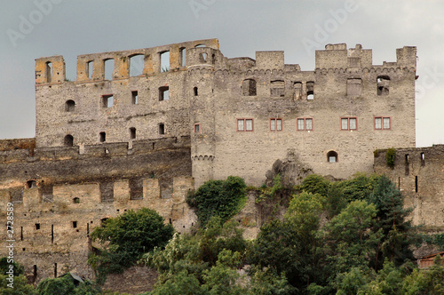 castle on hillside along mosel river in germany