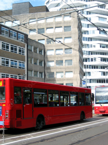 red bus on road