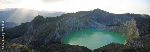 sunlight on the green crater lake, kelimutu volcano, flores, ind