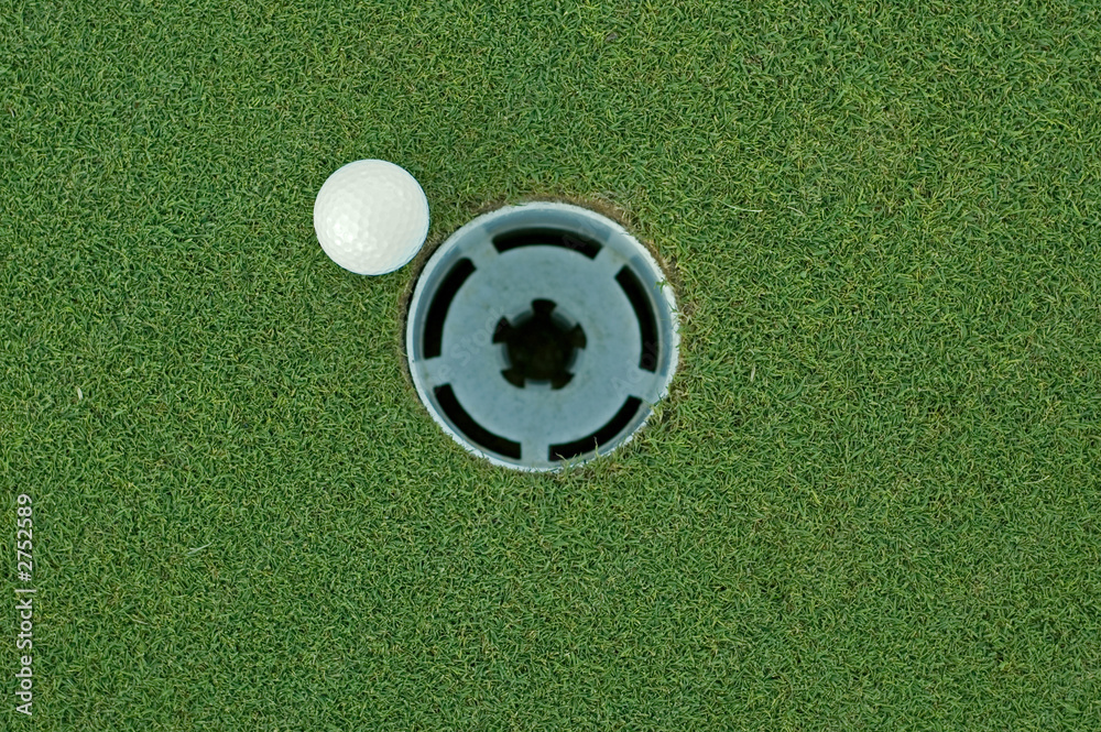 Obraz premium golf ball and hole