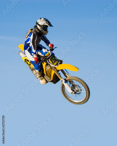 Fototapeta Naklejka Na Ścianę i Meble -  high flying motorcycle - yellow