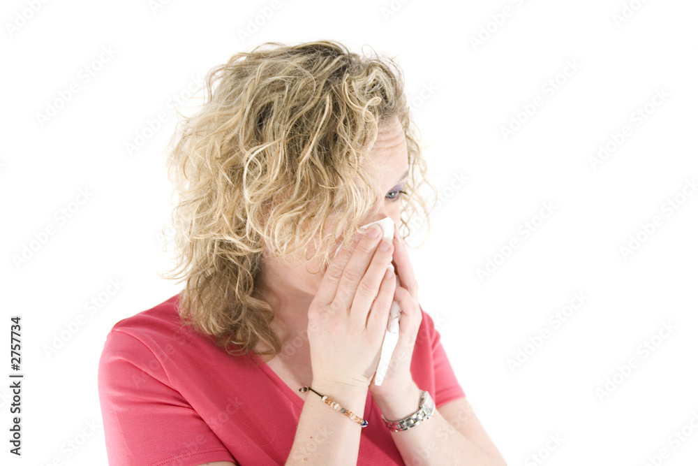 young blond girl sneezing in the handkerchief young blond girl sneezing in the handkerchief