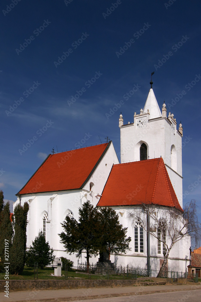 white village chapel and blue sky