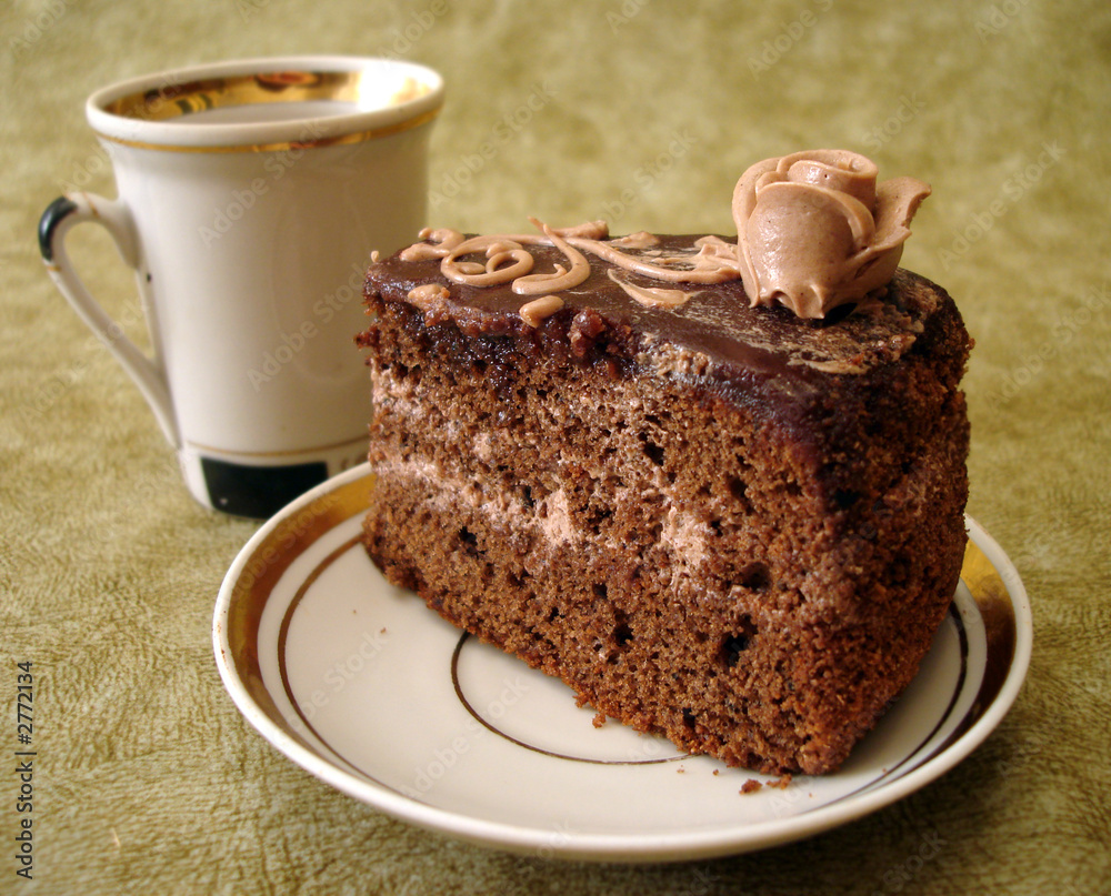 slice of chocolate cake on plate and cup slice of chocolate cake on plate and cup