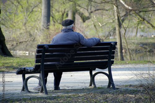 senior sitting in a park