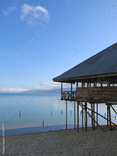 lake with clear water and a house with pile, poso lake, sulawesi