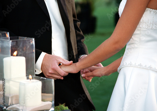 bride and groom holding hands