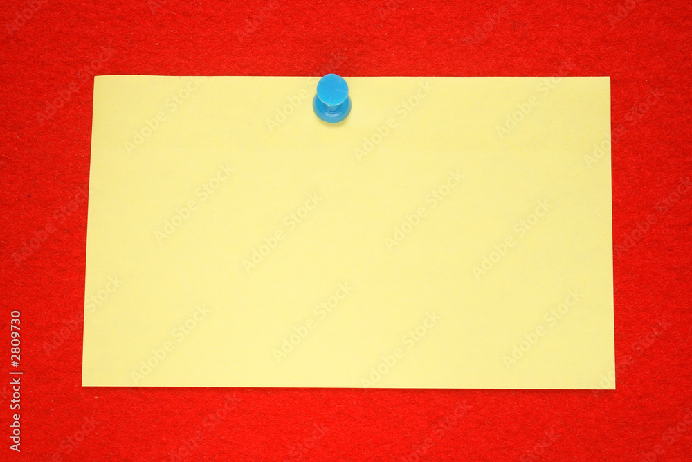 a yellow note held on a red felt notice board. a yellow note held on a red felt notice board.