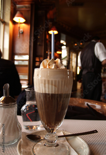 big cappuccino coffee with whipped cream and straw