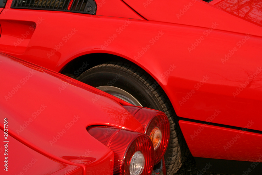 red supercar behind another red cars brakelight red supercar behind another red cars brakelight